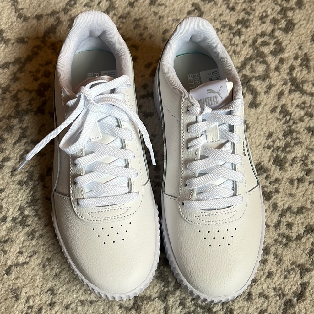 Women’s Puma sneakers with silver Puma on the side. Brand new with box!!!